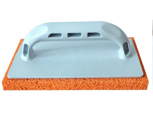 FRATTAZZO IN GOMMA MANICO IN PLASTICA COL.ARANCIO CM.14X22